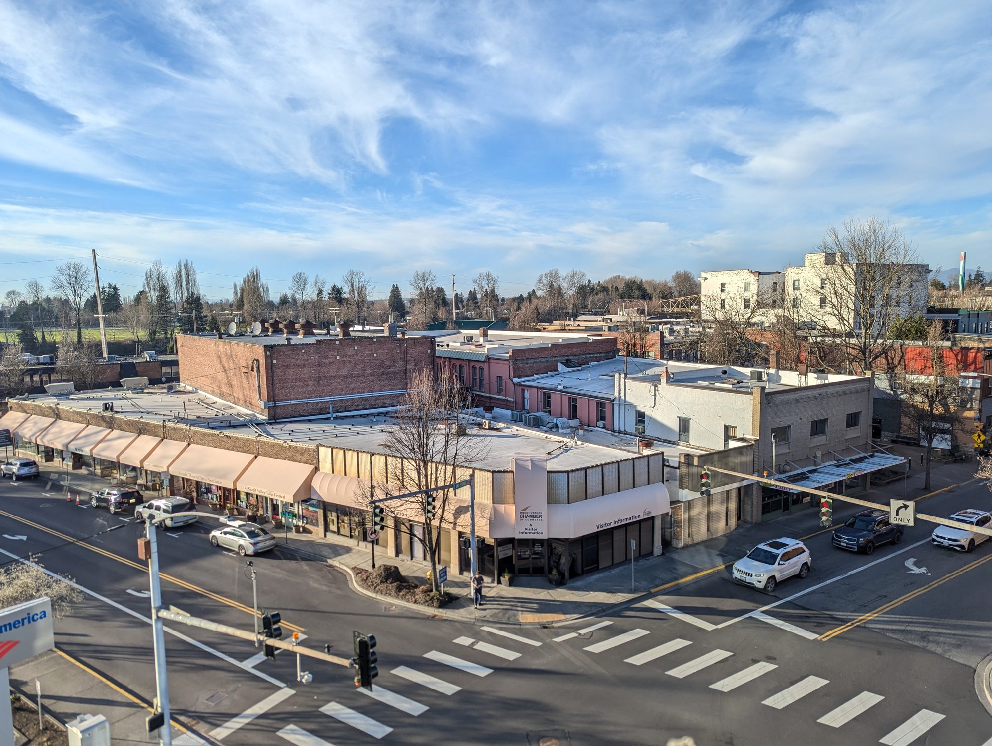 Aerial view of downtown Mount Vernon, Washington, showing historic brick buildings and the Skagit Valley beyond